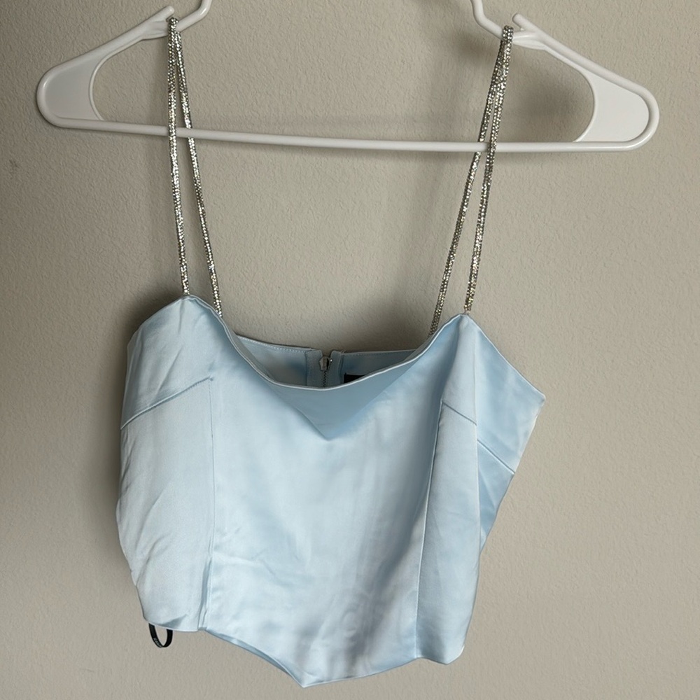 Light blue/pastel crop top with crystal like straps! Perfect for a night out!